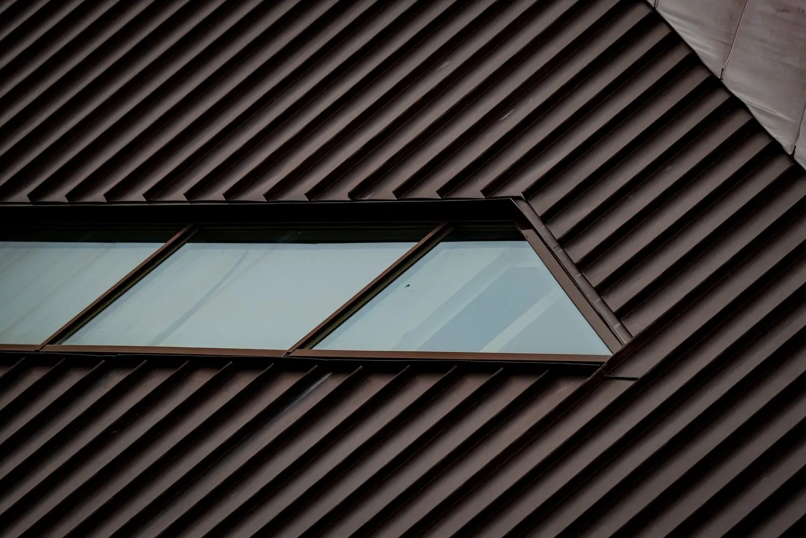 Dark standing seam metal roof with a skylight