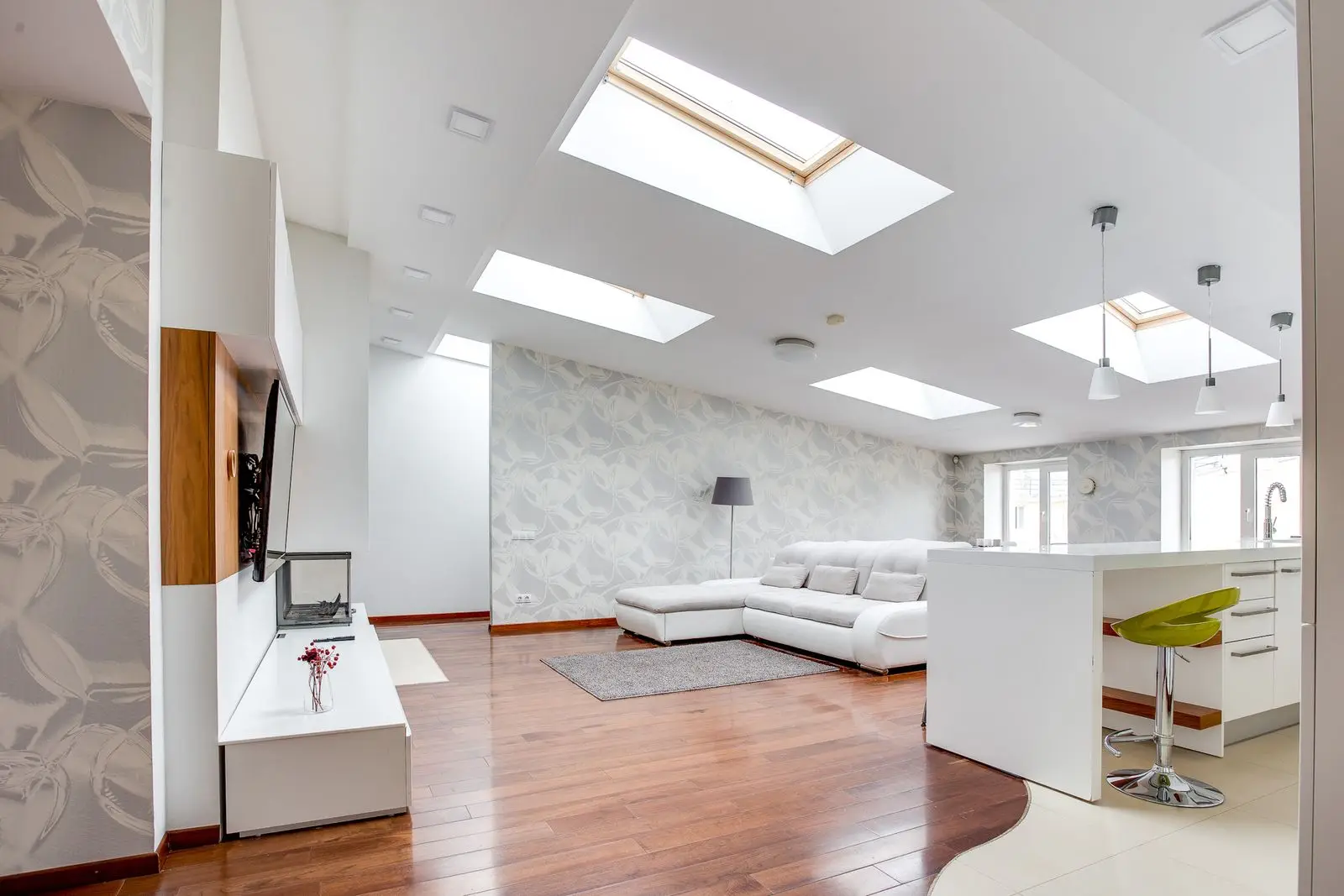 Bright living room lit by ceiling skylights